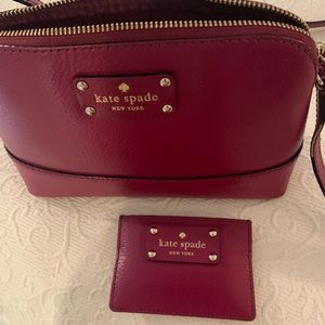 Kate Spade small pocketbook with matching wallet.